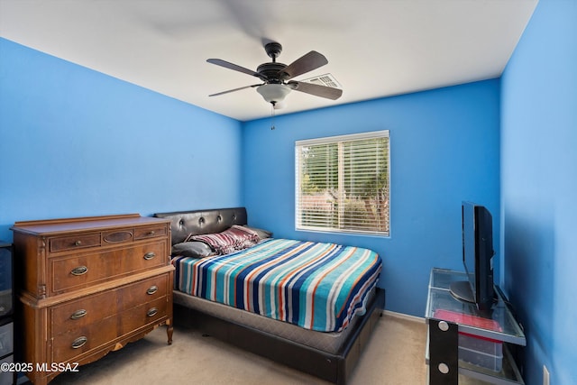 bedroom with baseboards, a ceiling fan, and light colored carpet