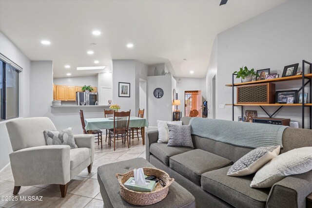 living area featuring recessed lighting and light tile patterned floors