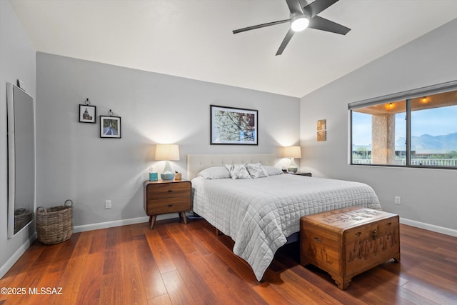 bedroom with wood-type flooring, baseboards, a ceiling fan, and vaulted ceiling