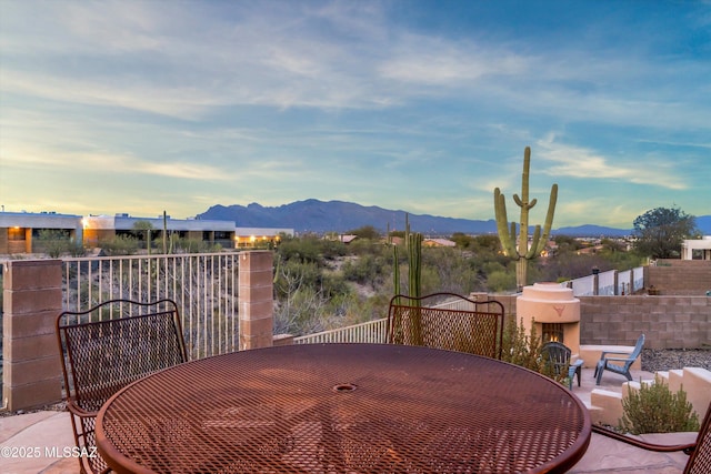 view of patio / terrace featuring a mountain view
