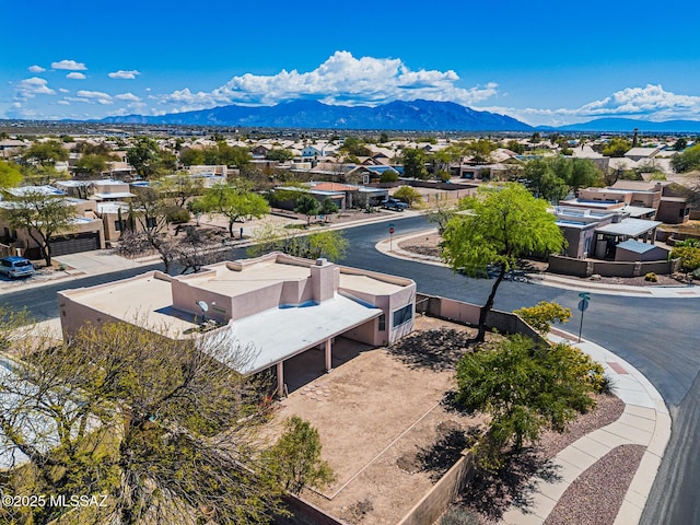 birds eye view of property with a residential view and a mountain view