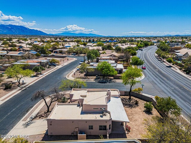 birds eye view of property with a residential view and a mountain view