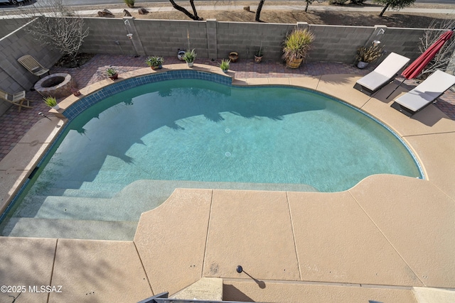 view of pool featuring a fire pit