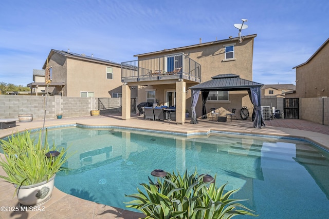 view of pool featuring a patio area, central AC unit, and a gazebo