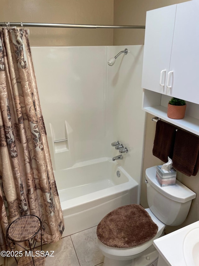 full bath featuring toilet, tile patterned flooring, and shower / bath combo with shower curtain