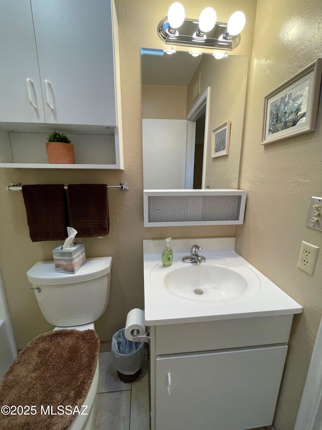 half bath with vanity and toilet