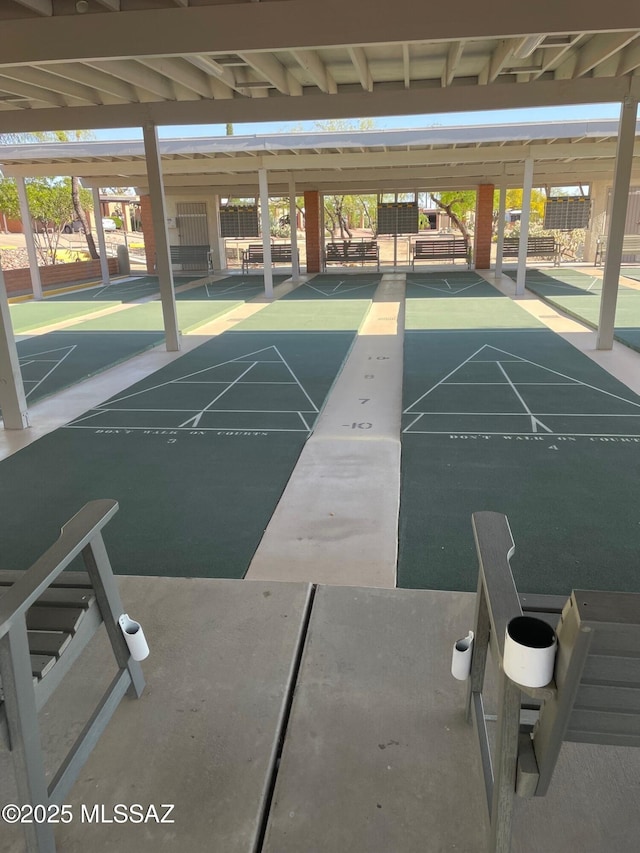 view of property's community featuring shuffleboard