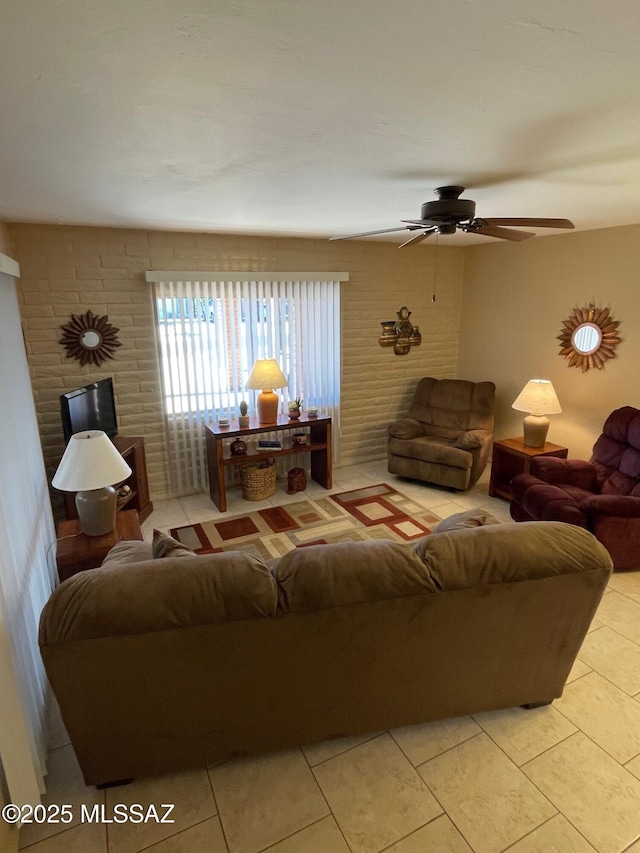 living room featuring light tile patterned floors and ceiling fan