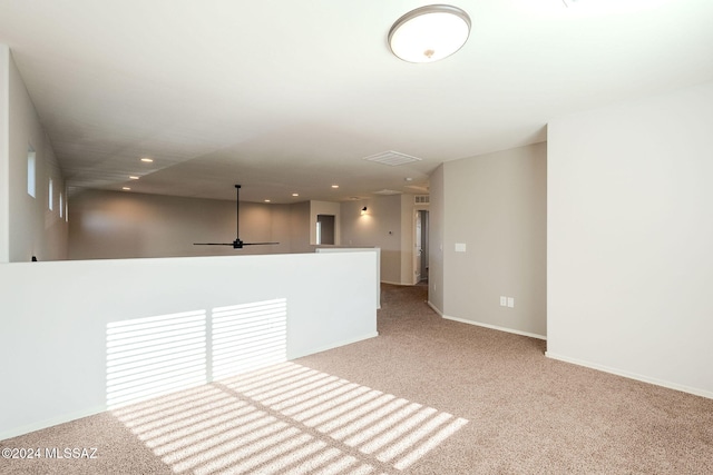 empty room featuring light colored carpet