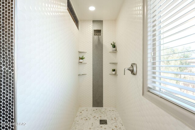 bathroom with a tile shower