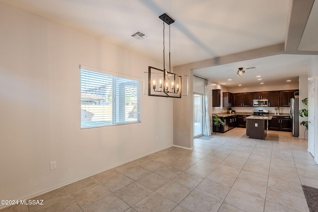 interior space with an inviting chandelier and light tile patterned floors