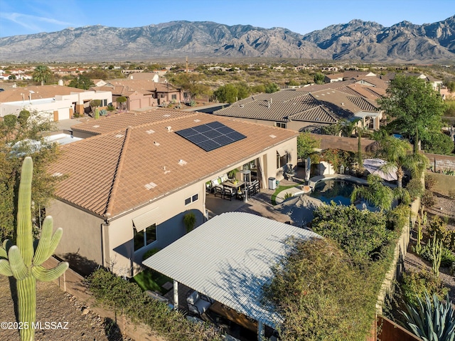 drone / aerial view featuring a residential view and a mountain view