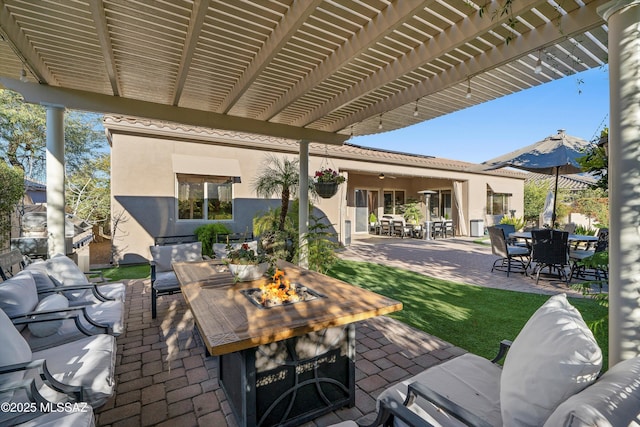 view of patio / terrace with outdoor dining area, an outdoor living space with a fire pit, and a pergola