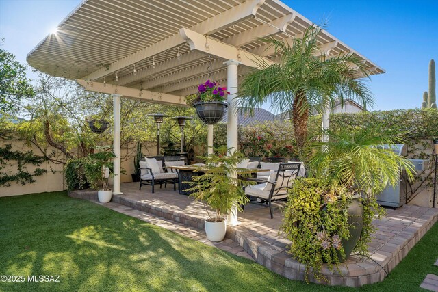 view of patio with a pergola and fence