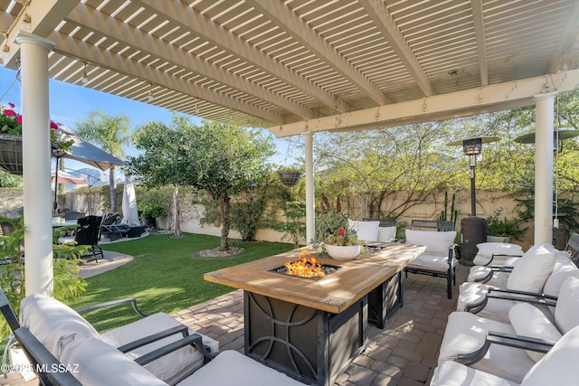 view of patio / terrace featuring an outdoor living space with a fire pit, a fenced backyard, and a pergola