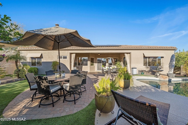 view of patio featuring outdoor dining area