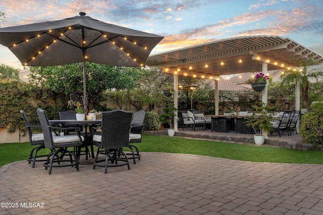 patio terrace at dusk with outdoor dining area, fence, and a pergola