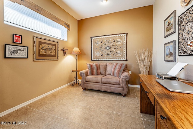 office space with light tile patterned floors and baseboards