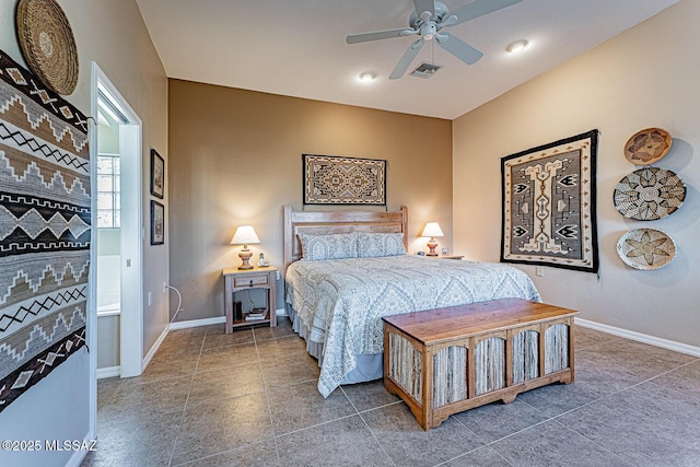 bedroom featuring baseboards, visible vents, ceiling fan, and dark tile patterned flooring