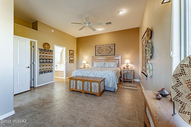 bedroom featuring ensuite bath, baseboards, visible vents, and ceiling fan