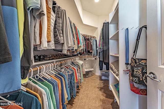 spacious closet with tile patterned floors