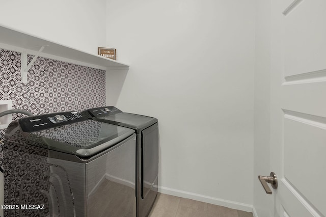 laundry room featuring washer and dryer, laundry area, and baseboards