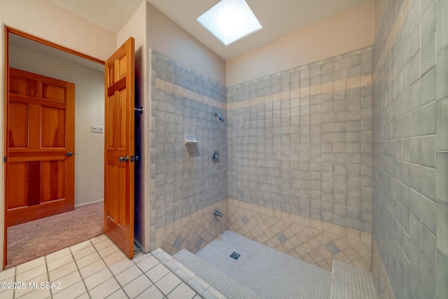 full bath with tile patterned flooring and tiled shower