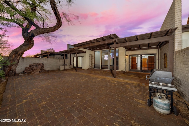 exterior space featuring a patio, french doors, fence, and a pergola