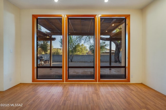 empty room with wood finished floors