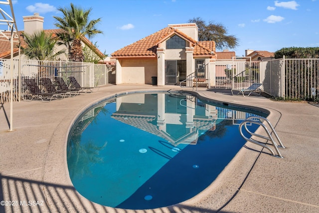 view of swimming pool with a patio area