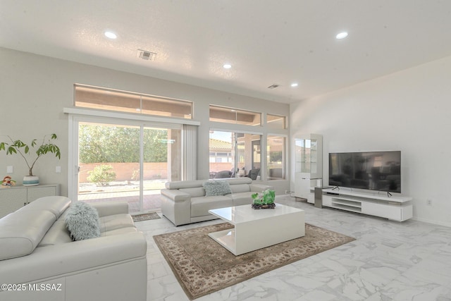 living room with baseboards, marble finish floor, visible vents, and recessed lighting