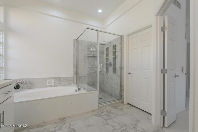 bathroom with marble finish floor, a shower stall, a bath, and vanity