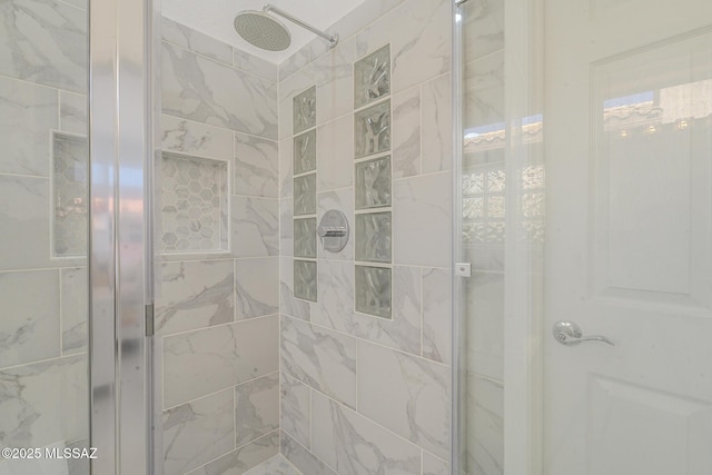 bathroom featuring a stall shower