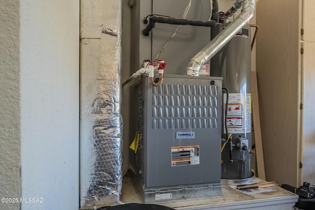 utility room featuring water heater and heating unit