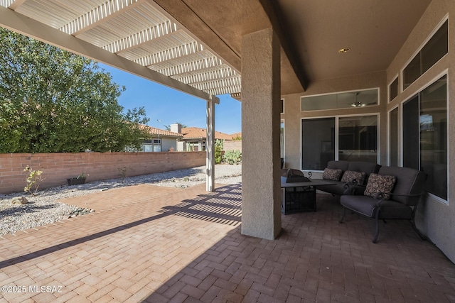 view of patio featuring fence, an outdoor hangout area, and a pergola