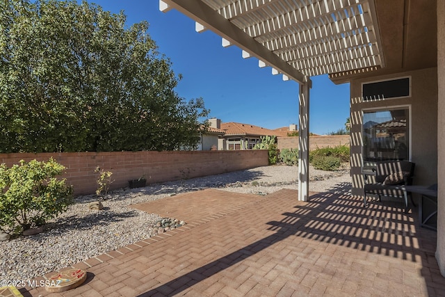 view of patio with a fenced backyard and a pergola