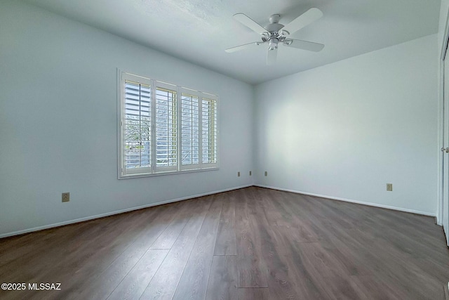 7471 E Serenity Ln, Tucson, AZ 85750 - empty room with ceiling fan, dark wood-style flooring, and baseboards