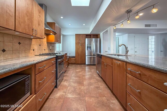 spare room featuring ceiling fan, baseboards, and tile patterned floors