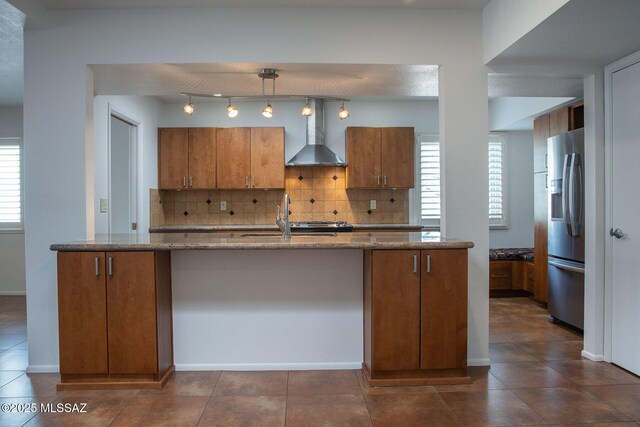 unfurnished living room with a ceiling fan, tile patterned flooring, a brick fireplace, and baseboards