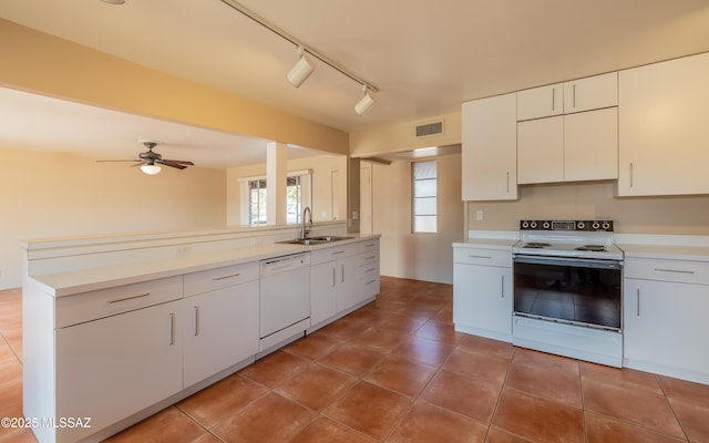 kitchen with ceiling fan, white appliances, a sink, white cabinets, and light countertops