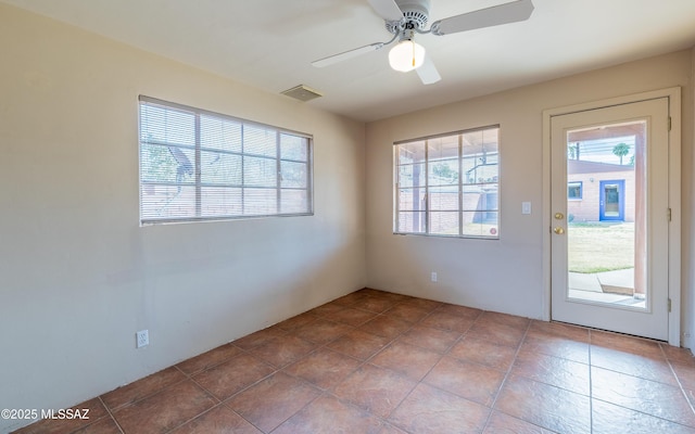 entryway with ceiling fan and visible vents