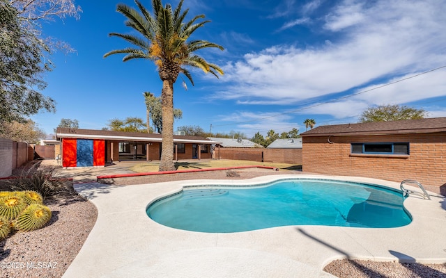 view of pool featuring a patio, a fenced backyard, and a fenced in pool