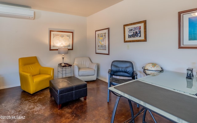 home office with finished concrete flooring, an AC wall unit, and baseboards