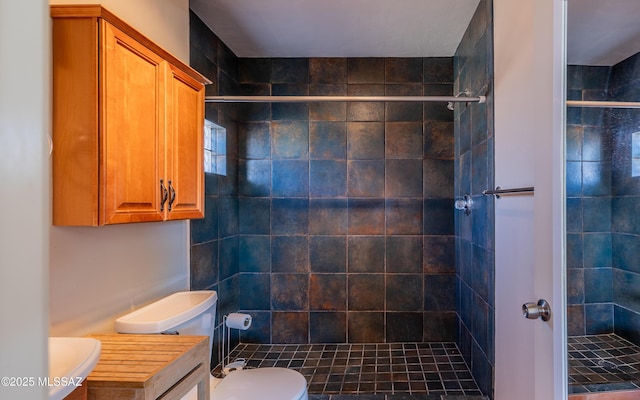 bathroom with toilet and a shower stall