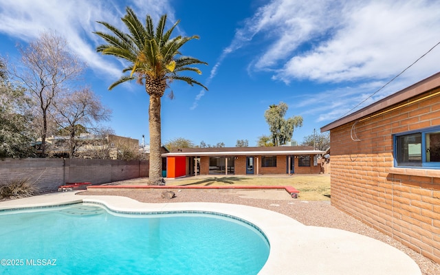 view of pool with a fenced in pool, a fenced backyard, and a patio