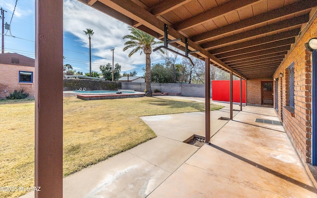 view of patio / terrace featuring a fenced backyard and a jacuzzi