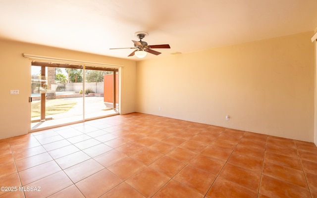 unfurnished room with light tile patterned floors and ceiling fan