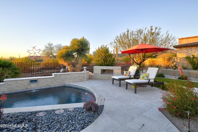 view of pool with a fenced in pool, a patio, and fence