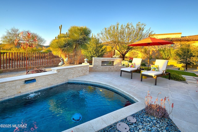 view of pool with a patio area, fence, and a fenced in pool