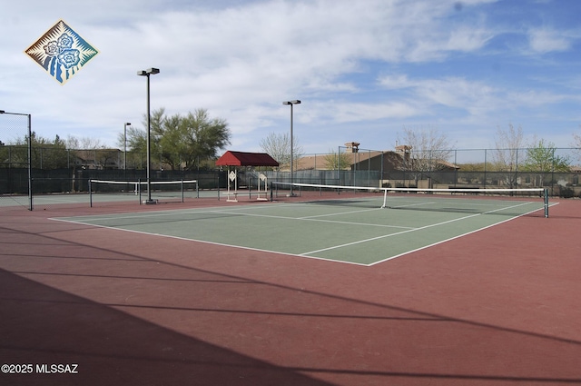 view of sport court with community basketball court and fence